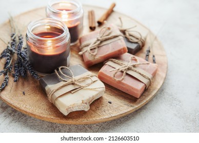 Concept of spa with natural organic handmade soap. Moisturizing skin care and aromatherapy. Gentle body treatment. Handmade soap. Atmosphere of harmony, relax. flowers, candle