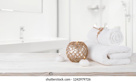 Concept Of Spa Treatment On Wooden Table And Blurred Bathroom