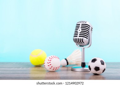  Concept Sports Commentator : The Retro Microphone Put On The Wooden Table With Football Or Soccer , Tennis Ball , Baseball And Shuttlecock Isolated On Blue Background