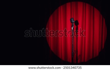 Similar – Image, Stock Photo Microphone on stand on stage close up with searchlight light. Professional mic at concert hall or conference room, karaoke, night club, bar. Public events, festival, wedding. Copy space.