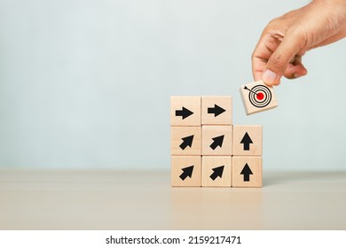 Concept Of Step To Goal. Hand Holding Wooden Cube Block With Goal Icon. Target Business Growth Success. Vision Teamwork Corporate Leading To Progress.