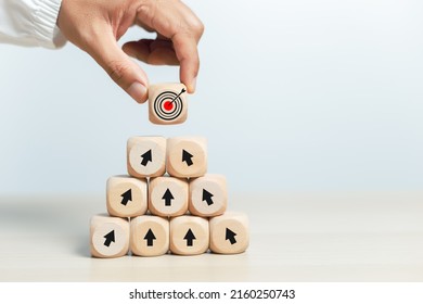 Concept Of Step To Goal. Hand Holding Wooden Cube Block With Goal Icon. Target Business Growth Success. Vision Teamwork Corporate Leading To Progress.