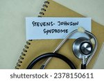 Concept of Stevens-Johnson Syndrome write on sticky notes isolated on Wooden Table.