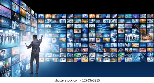 Concept of streaming video with businessman - Shutterstock ID 1296368215
