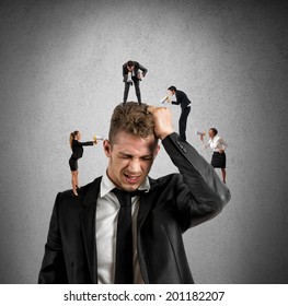 Concept of stress at work with small people shouting with megaphone - Powered by Shutterstock