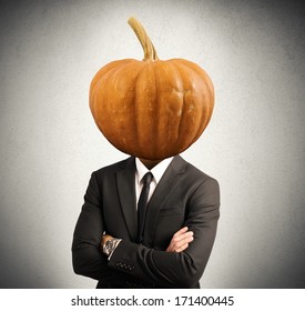 Concept Of Stubborn Businessman With Pumpkin In Head