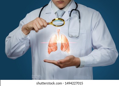 The Concept Study Of The Lung Of The Patient. The Doctor Looks Through A Magnifying Glass On A Lung.