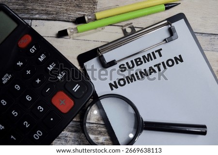 Concept of Submit nomination write on clipboard isolated on Wooden Table.