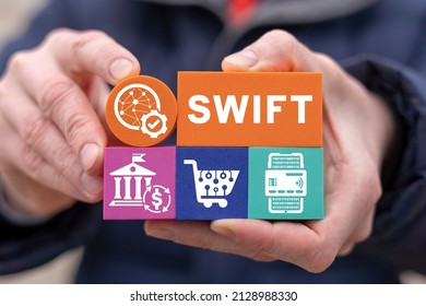 Concept of SWIFT. Banking Electronic Web Payment Financial System. Society for Worldwide Interbank Financial Telecommunications. Man holding polystyrene blocks with SWIFT inscription.