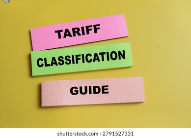 Concept of tariff classification guide write on sticky notes isolated on Wooden Table. For international trade and import-export regulations