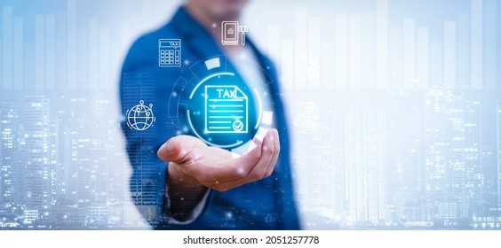 Concept of taxes payment optimisation business finance, Businessman holding taxes button on technology screen,income tax and property, background for business, individuals and corporations such as VAT