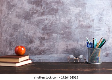 Concept To Teacher's Day. Pens, Apple, Pencils, Books And Glasses On Table. Back To School, Copy Space.