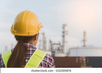 Concept Of Team, Engage, Construction, Professional, Safety And Industry.construction Worker Or Engineer With Yellow Helmet Safety Going Work Industrial Zone,The Equipment Of Oil Refining In Morning