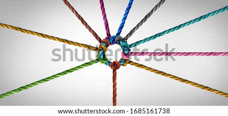 Concept of team unity and teamwork idea as a business metaphor for joining a partnership as diverse ropes connected together as a corporate symbol for cooperation and working collaboration.