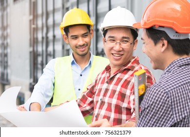 Concept Teamwork Of Building Construction Staff. Project Engineer / Contractor Reviewing Plan Of Work With Foreman And Worker At Construction Site.