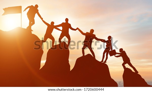 Concept of\
teamwork with team climbing mountain\
top