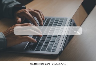 Concept technology data search information with search engine optimization, business people's hands are typing to searching information through the Internet website on the computer keyboard.
