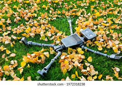 The concept of technology development in the form of artificial intelligence in a robot lives and experiences feelings lying on the grass.