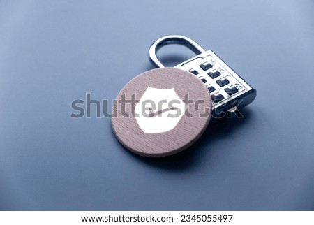 Concept of technology internet, cyber security, database, data privacy, and web protection concept.Padlock with a wooden have a shield symbol.