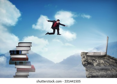 Concept Of Technology Migration With Business Person Jumping From Book To Laptop