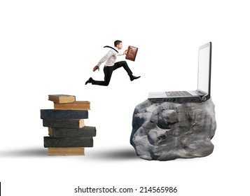 Concept Of Technology Migration With Businessman Jumping From Book To Laptop