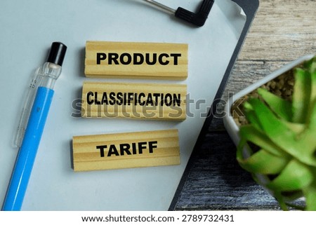 Concept of text product classification tariff on wooden blocks. For international trade, customs compliance and import duties