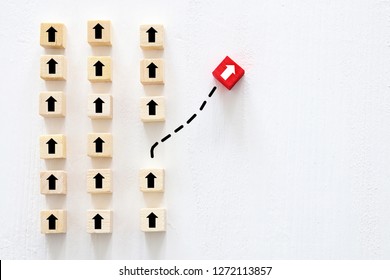 Concept Of Think Different, Innovation And Creativity.  Red Cube Changing Direction From Others. 