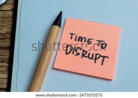Concept of Time to Disrupt write on sticky notes isolated on Wooden Table.