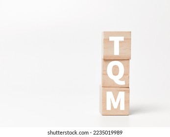Concept of total quality management on wooden cubes. - Shutterstock ID 2235019989