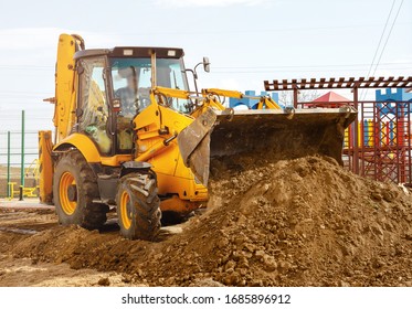 Concept of the tractor, the tractor digs and buries a trench 