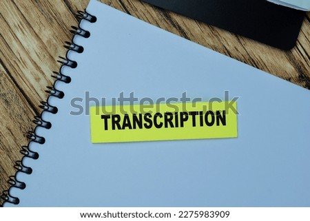 Concept of Transcription write on sticky notes isolated on Wooden Table.