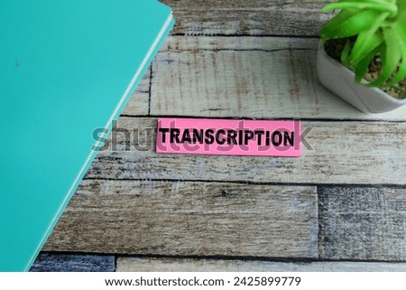 Concept of Transcription write on sticky notes isolated on Wooden Table.