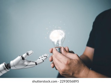The concept of transferring knowledge from the human brain to AI or artificial intelligence to learn and develop the world. ,the hand of the robot picks up smart brain icon