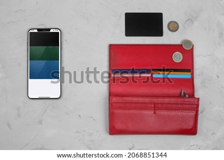 The concept of transferring money to the phone. Payment via smartphone. Phone with connected credit cards or psychic credit card, coins and wallet. Electronic money. Process of avoiding physical money Stock photo © 