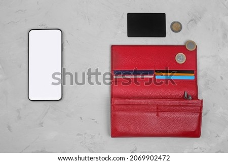 The concept of transferring money to the phone. Payment via smartphone. Phone with connected credit cards or psychic credit card, coins and wallet. Electronic money. Process of avoiding physical money Stock photo © 