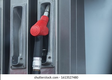 The Concept Of The Transition To Electric Cars. A Lonely Abandoned Gas Pistol At A Gas Station.