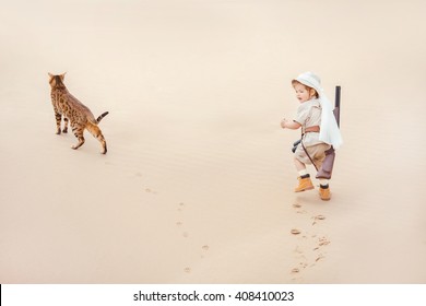 Concept Of Travel And Fascinating Adventures. Hild In Suit Of Treasures Seeker Like Indiana Jones In The Desert Whit Wild Cat Similar To Tiger