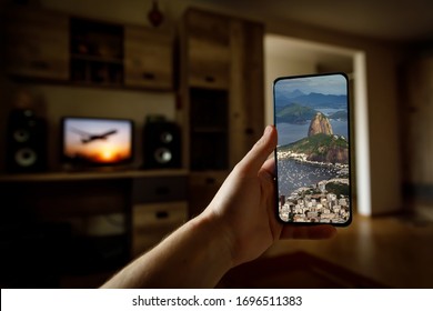 Concept Of Travel On A Smartphone. Stay At Home Tourism. Online Travel To Rio-De-Janeiro. Sugarloaf On A Screen.