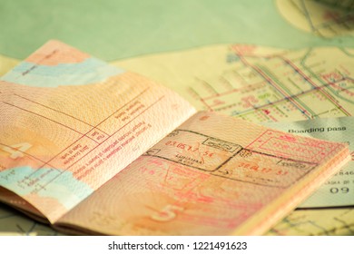 The concept of travel. Russian passport with visas. Passport and plane ticket is on the old map. Sunlight and shadow - Shutterstock ID 1221491623