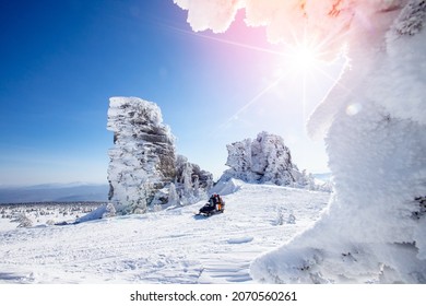 Concept Travel Tourist Group Snowmobile Tour In Frozen Forest. Polar Arctic Snow Mountains.