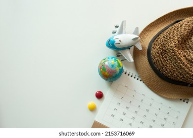 Concept Of Travel Vacation Trip And Long Summer Weekend Planning On Calendar White Table Background