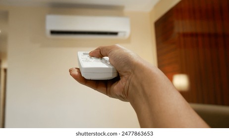 Concept of turning on or off ac or air conditioner by remote control.