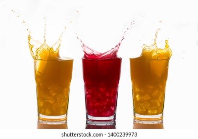 Concept Of Unique And One Of A Kind Represented With Splashes On Glasses Of Orange Juice And Strawberry Juice