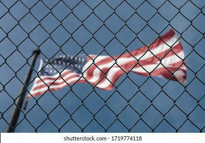Concept of United States of America closed borders with flag and wire fence. USA immigration and homeland security. American dream concept, not accessible and hard to reach.