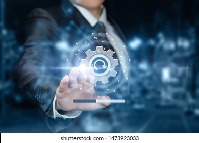 The concept of upgrading or rebooting the system. The businessman clicks on the refresh icon. - Shutterstock ID 1473923033