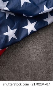 Concept Of U.S Independence Day Or Memorial Day. National Flag Over Dark Gray Table Background.