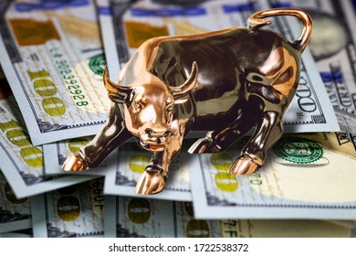 Concept Of Usa Cash Money.  Copper Bull Standing On Hundred Us Dollar Bills. Macro Image.