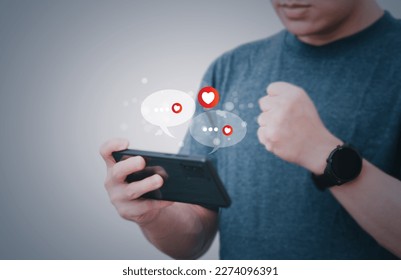 The concept of using digital media, technology, and social media. Surfing online, male hand using smartphone To chat or use social media, remote work concept, work from home via the Internet