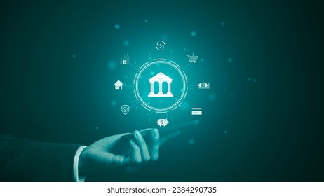 The concept of using digital technology for online banking. Businessman is holding a phone with icons of online banking technology. Customer withdraw money, Internet, bank account, shopping, payment,