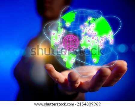 Concept of using modern swift platform around world in business. Businesswoman holding virtual globe of planet earth on hand with connection lines of financial transactions.